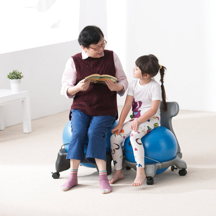 Adult and child on ball chairs