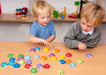 Children playing with wooden Sorting Lady birds